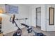 Workout room featuring exercise equipment, a whiteboard with messages, and closet at 23882 W Yavapi St, Buckeye, AZ 85326