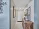 Neutral hallway featuring decor and tile flooring at 23882 W Yavapi St, Buckeye, AZ 85326