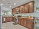 Well-equipped kitchen featuring generous counter space and wood cabinetry at 23882 W Yavapi St, Buckeye, AZ 85326