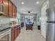 Open-concept kitchen flowing into an office space, complete with stainless steel appliances at 23882 W Yavapi St, Buckeye, AZ 85326