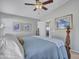 Comfortable main bedroom featuring tray ceiling, ceiling fan, and carpet at 23882 W Yavapi St, Buckeye, AZ 85326