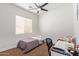 Bedroom featuring neutral walls, carpet, and a large window for natural light at 2436 W Kachina Trl, Phoenix, AZ 85041