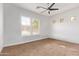 Spacious bedroom with neutral carpet and ample natural light from windows at 2436 W Kachina Trl, Phoenix, AZ 85041