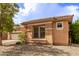 Exterior view of a lovely neutral toned single-story home with tile roof and desert landscaping at 2436 W Kachina Trl, Phoenix, AZ 85041