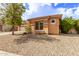 Exterior shot of a lovely neutral toned single-story home with tile roof and desert landscaping at 2436 W Kachina Trl, Phoenix, AZ 85041