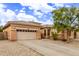 Charming single-story home with a neutral-toned exterior, low-maintenance desert landscaping, and a two-car garage at 2436 W Kachina Trl, Phoenix, AZ 85041