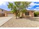 Inviting single-story home featuring desert landscaping and a convenient two-car garage at 2436 W Kachina Trl, Phoenix, AZ 85041