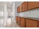 Hallway with overhead cabinets and countertops at 2436 W Kachina Trl, Phoenix, AZ 85041