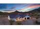 Scenic aerial view of a modern home nestled in the beautiful desert landscape at 2438 N 113Th St, Mesa, AZ 85207