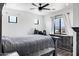 Bedroom with neutral walls, gray bedding, and two windows at 2438 N 113Th St, Mesa, AZ 85207