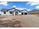 Stunning new construction home with black-framed windows and modern garage doors at 2438 N 113Th St, Mesa, AZ 85207