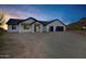 Inviting single-story home featuring a modern garage and desert surroundings at 2438 N 113Th St, Mesa, AZ 85207