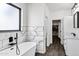 Modern main bathroom features a standalone tub, marble tiling, and a vanity with a white countertop at 2438 N 113Th St, Mesa, AZ 85207