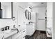 Bright main bathroom with double vanities, marble countertops, modern fixtures, and access to the walk-in closet at 2438 N 113Th St, Mesa, AZ 85207