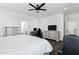 The bright main bedroom features a ceiling fan, and a view of the main bathroom and walk-in closet at 2438 N 113Th St, Mesa, AZ 85207