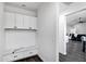 Mud room with storage cabinets, drawers, and a seating nook at 2438 N 113Th St, Mesa, AZ 85207