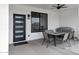 Outdoor patio area with ceiling fan, window, grill and dining table with six chairs at 2438 N 113Th St, Mesa, AZ 85207