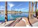 Backyard featuring stairs leading to the lake, mature trees, and lush landscape on a sunny day at 2542 S Playa --, Mesa, AZ 85202