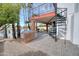 Backyard featuring spiral stairs, a built-in grill, and waterfront view at 2542 S Playa --, Mesa, AZ 85202