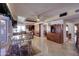 Bright and open dining area featuring tile floors, a glass table, and views of the kitchen at 2542 S Playa --, Mesa, AZ 85202