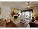 Bright living room featuring a fireplace and large bay window at 2542 S Playa --, Mesa, AZ 85202