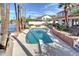 Beautiful backyard pool with mature landscaping and lake views, creating a serene outdoor oasis at 2542 S Playa --, Mesa, AZ 85202