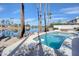 Sparkling backyard pool with diving board, surrounded by well-maintained landscaping and scenic lake views at 2542 S Playa --, Mesa, AZ 85202