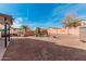 Large backyard features a swing set, fire pit, and plenty of room to play and relax at 25732 W St James Ave, Buckeye, AZ 85326