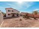 A full view of the massive backyard, complete with a built-in play structure and a patio at 25732 W St James Ave, Buckeye, AZ 85326