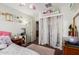 Cozy bedroom featuring curtains, a fan, and closet at 25732 W St James Ave, Buckeye, AZ 85326