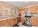 Well-lit kitchen features stainless steel appliances and plenty of counter space at 25732 W St James Ave, Buckeye, AZ 85326