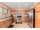 Functional kitchen featuring stainless steel appliances, ample cabinet space, and natural light at 25732 W St James Ave, Buckeye, AZ 85326