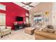 Bright living room showcasing high ceilings, stylish decor, and a large window at 25732 W St James Ave, Buckeye, AZ 85326