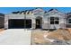 New construction featuring a modern design, spacious garage, and durable roofing tiles for lasting curb appeal at 28216 N Nealite Dr, San Tan Valley, AZ 85143