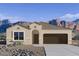 Charming single-story home featuring desert landscaping, a two-car garage, and mountain views at 28216 N Nealite Dr, San Tan Valley, AZ 85143