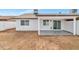 Backyard with a covered patio and white-painted concrete block wall at 3026 W Ross Ave, Phoenix, AZ 85027