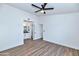 Spacious bedroom featuring wood-look floors and an en-suite bathroom at 3026 W Ross Ave, Phoenix, AZ 85027