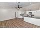 Open-concept layout of living room and kitchen with modern fixtures and finishes at 3026 W Ross Ave, Phoenix, AZ 85027