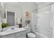 Bathroom featuring a white vanity, shower and tub combination, and decorative accents at 303 S 197Th Ave, Buckeye, AZ 85326