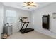 Bedroom with a ceiling fan and large mirror on the wall at 303 S 197Th Ave, Buckeye, AZ 85326