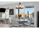 Dining area with circular table and a large sliding glass door to the backyard at 303 S 197Th Ave, Buckeye, AZ 85326