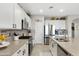 Bright kitchen featuring stainless steel appliances and a large center island with sink at 303 S 197Th Ave, Buckeye, AZ 85326