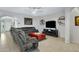 Living room features a ceiling fan and large gray sectional sofa at 303 S 197Th Ave, Buckeye, AZ 85326