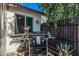 View of the backyard featuring a grill, lush greenery, and a privacy fence for outdoor enjoyment at 3120 N 67Th Ln # 31, Phoenix, AZ 85033