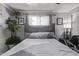 Bright bedroom featuring a cozy bed, pictures and natural lighting at 3120 N 67Th Ln # 31, Phoenix, AZ 85033