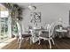 Charming dining area with a glass-topped table and decorative white chairs at 3120 N 67Th Ln # 31, Phoenix, AZ 85033