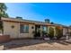 Attractive house with updated windows, desert landscaping, and an inviting facade at 3120 N 67Th Ln # 31, Phoenix, AZ 85033