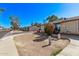 Exterior view showcasing landscaping and neat curb appeal in a residential neighborhood at 3120 N 67Th Ln # 31, Phoenix, AZ 85033