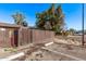 Assigned parking lot in the community featuring a parking spot behind a wooden privacy fence at 3120 N 67Th Ln # 31, Phoenix, AZ 85033