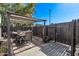 Charming backyard patio with a dining set, a fence, and a pergola at 3120 N 67Th Ln # 31, Phoenix, AZ 85033